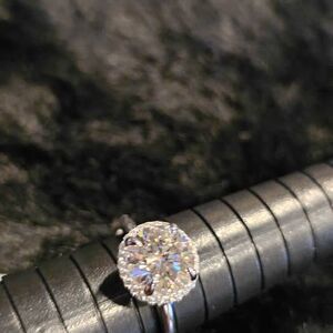 2.5CTW VVSD Moissanite Solitaire in .925 sterling silver halo setting. Size 7